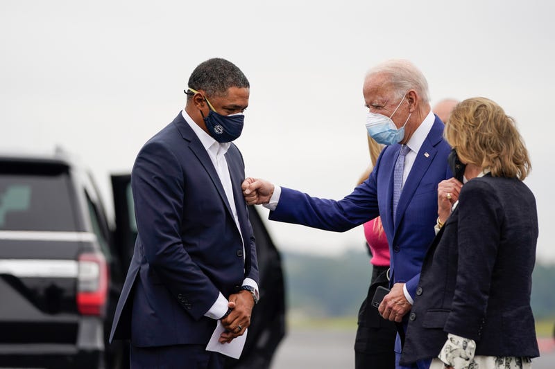 (L-R) Rep. Cedric Richmond (D-LA) and Joe Biden greet each other as Biden arrives at Columbus Airport on October 27, 2020 in Columbus, Georgia. Biden is campaigning in Georgia on Tuesday, with scheduled stops in Atlanta and Warm Springs. 