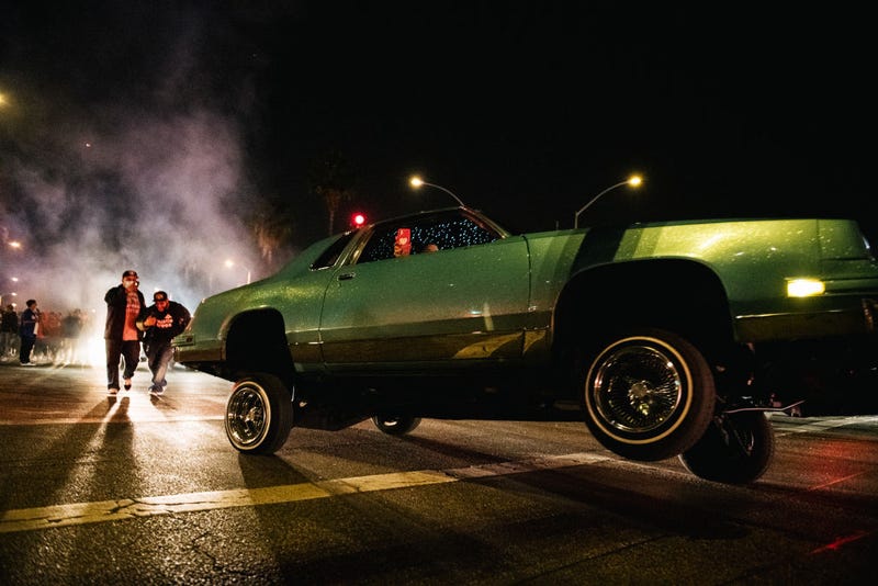 Dodgers fans celebrate in a lowrider vehicle after the Los Angeles Dodgers defeated the Tampa Bay Rays 3-1 on October 27, 2020 in Los Angeles, California.  