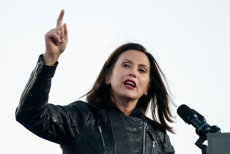 Michigan Governor Gretchen Whitmer speaks in front of a microphone