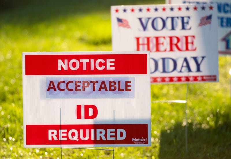 Signs greet voters at a polling place on Election Day, Nov. 3, 2020.
