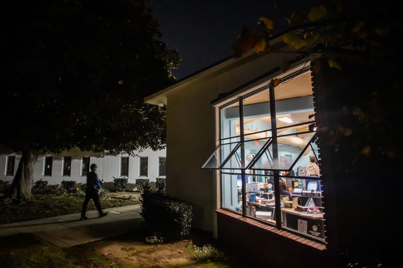 library with windows open at night