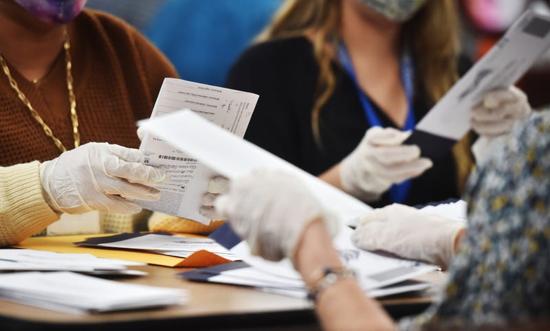 Luzerne County employees open mail-in ballots to be counted at the elections board in Wilkes-Barre.