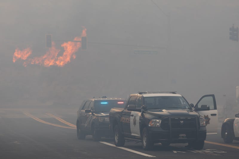Reno Police block road access while engulfed in wildfire smoke from the Pinehaven Fire on November 17, 2020 in Reno, Nevada.