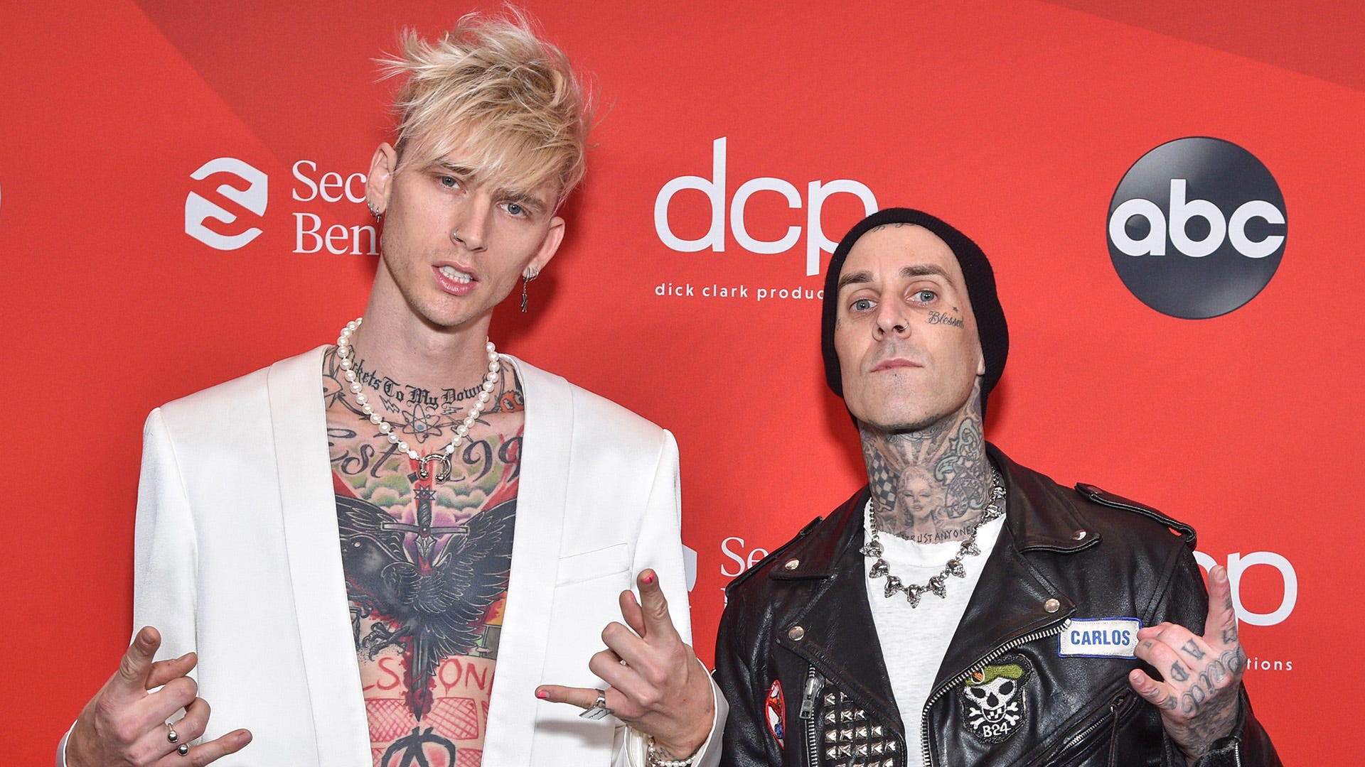 See Machine Gun Kelly announce a new album with Travis Barker with matching tattoos, of course