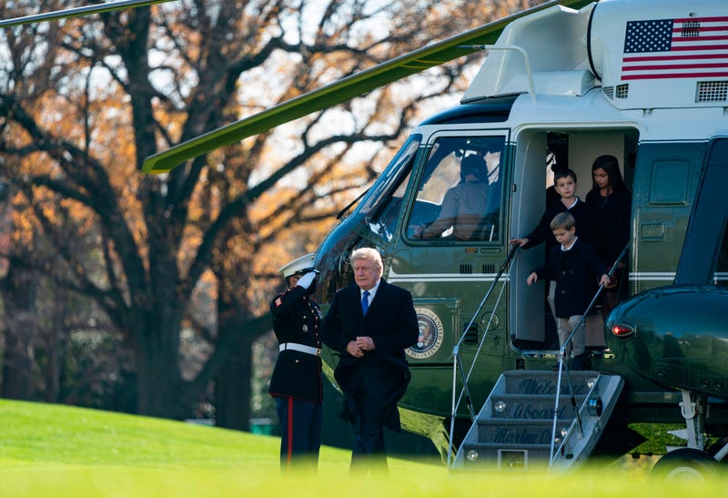 President Donald Trump, followed by his grandchildren Arabella, Theodore, and Joseph, arrives at the White House aboard Marine One on November 29, 2020 in Washington, DC. - President Trump spent the Thanksgiving weekend at Camp David and his Trump National Golf Course in Virginia.