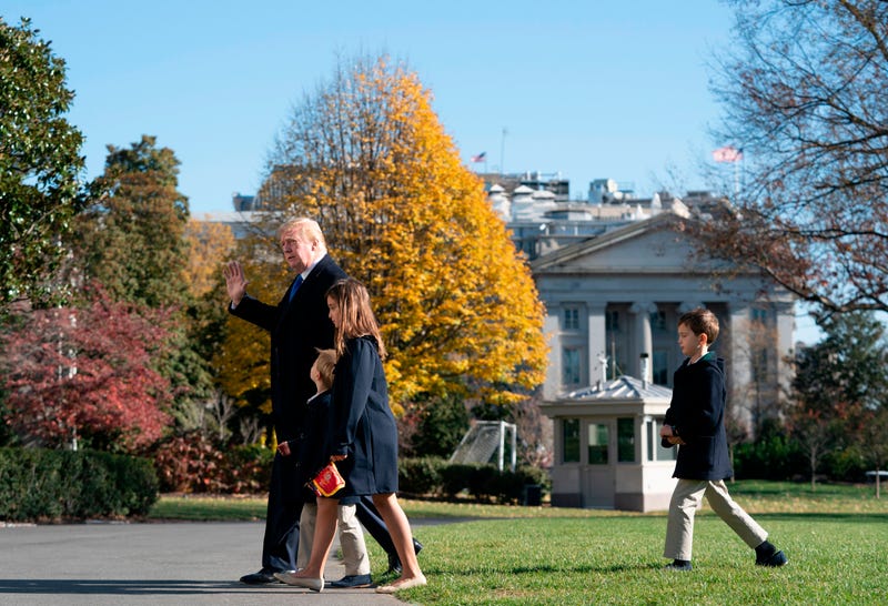 US President Donald Trump, followed by his grandchildren Arabella, Theodore, and Joseph, arrives at the White House on November 29, 2020 in Washington, DC. - President Trump spent the Thanksgiving weekend at Camp David and his Trump National Golf Course in Virginia.