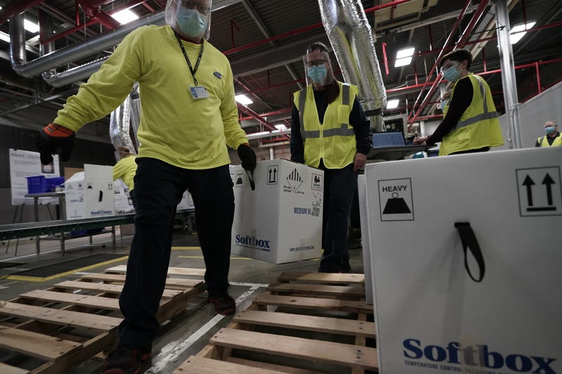 Boxes containing the Pfizer-BioNTech COVID-19 vaccine are prepared to be shipped at the Pfizer Global Supply Kalamazoo manufacturing plant on December 13, 2020 in Portage, Michigan.