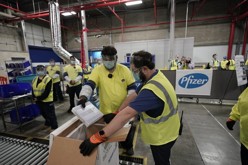 Boxes containing the Pfizer-BioNTech COVID-19 vaccine are prepared to be shipped at the Pfizer Global Supply Kalamazoo manufacturing plant on December 13, 2020 in Portage, Michigan. 