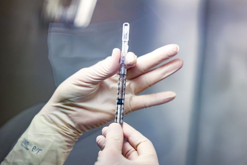Rocky Mountain Regional VA Medical Center investigational pharmacy technician Sara Berech prepares a dose of the Johnson & Johnson COVID-19 vaccine for a clinical trial on December 15, 2020 in Aurora, Colorado.