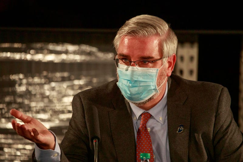 Indiana Governor Eric Holcomb wearing a face mask speaks during a round table discussion at Catalent Biologics, where COVID vaccine vials are being filled.