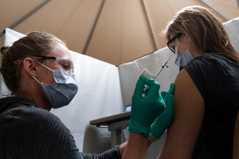 A healthcare worker at the Portland Veterans Affairs Medical Center receives a COVID-19 vaccination on December 16, 2020 in Portland, Oregon. The first rounds of Pfizer's vaccine were administered in Oregon on Wednesday.
