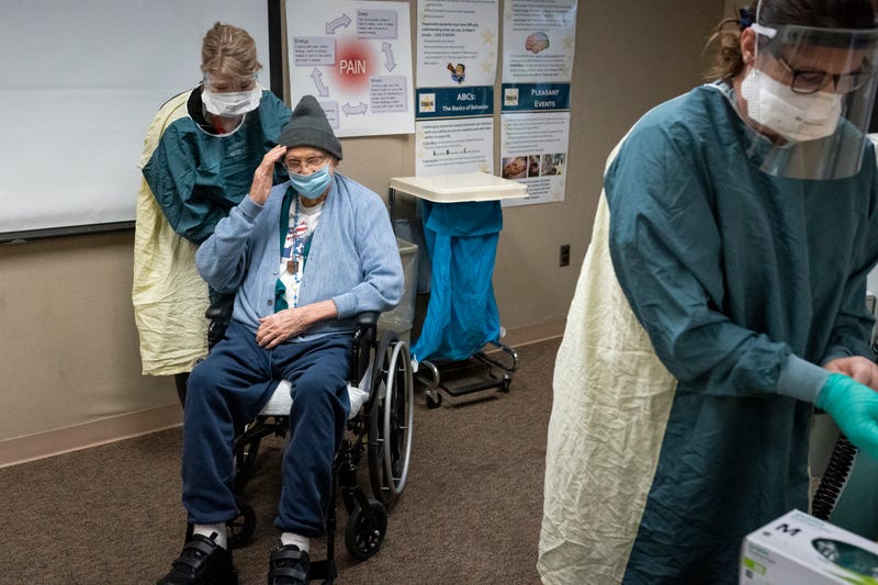 World War II Army veteran John Stephens, 96, salutes after receiving a COVID-19 vaccine at a Veterans Affairs long-term care facility on December 17, 2020 in Vancouver, Washington. Patients in long-term care facilities began receiving the Pfizer-BioNTech COVID-19 vaccine in Oregon this week.