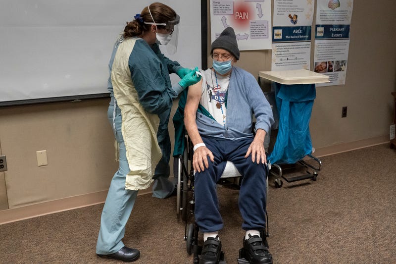 World War II Army veteran John Stephens, 96, receives a COVID-19 vaccine at a Veterans Affairs long-term care facility on December 17, 2020 in Vancouver, Washington. Patients in long-term care facilities began receiving the Pfizer-BioNTech COVID-19 vaccine in Oregon in December.