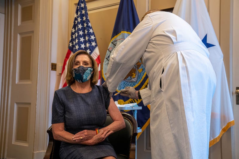 Speaker of the House Nancy Pelosi (D-CA) receives a COVID-19 vaccination shot by Dr. Brian Monahan (R), attending physician of the Congress of the United States, in her office on Capitol Hill on December 18, 2020 in Washington, DC.