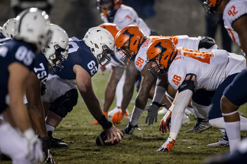 A general view of the line of scrimmage as Michal Menet #62 of the Penn State Nittany Lions prepares to snap the ball against the Illinois Fighting Illini defense during the second half at Beaver Stadium on December 19, 2020 in State College, Pennsylvania.
