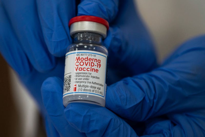  Michelle Chester, DNP, director of employee health services at Northwell Health, shows the Moderna COVID-19 vaccine at Long Island Jewish Valley Stream Hospital on December 21, 2020 in Valley Stream, New York. 