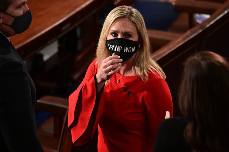 U.S. Rep. Marjorie Taylor Greene (R-GA) wears a "Trump Won" face mas