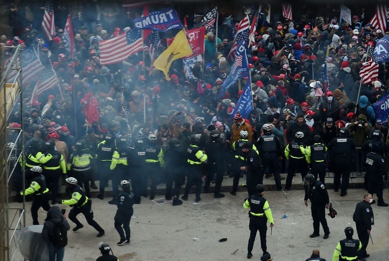 Police hold back supporters of Donald Trump as they gather outside the U.S. Capitol's Rotunda on Jan. 6, 2021, in Washington, D.C.