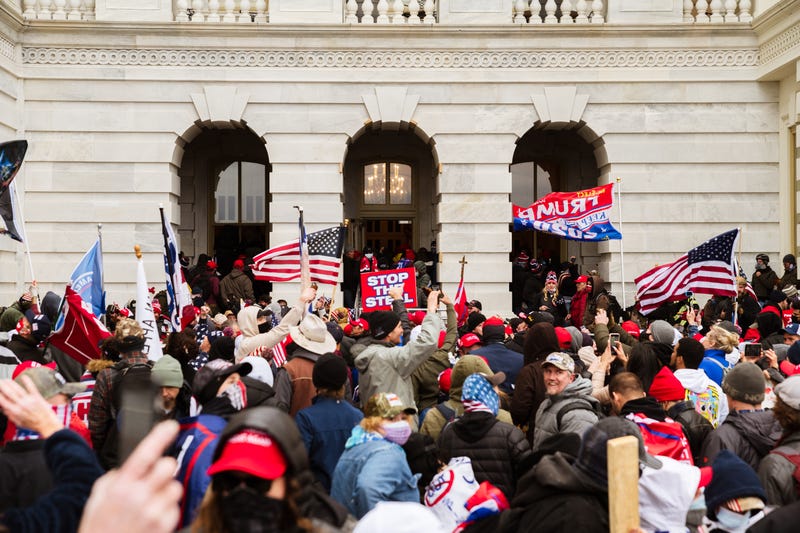 A pro-Trump mob floods into the Capitol Building after breaking into it on January 6, 2021 in Washington, DC. A pro-Trump mob stormed the Capitol, breaking windows and clashing with police officers.