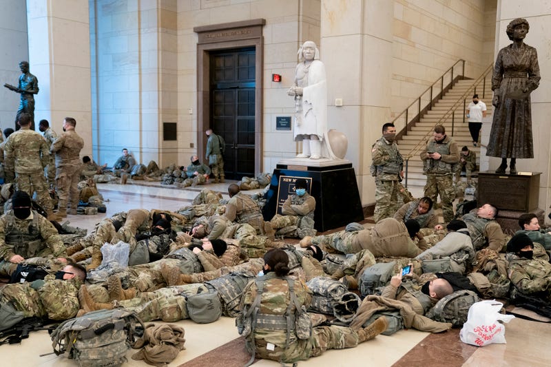 Members of the National Guard rest in the Visitor Center of the U.S. Capitol on January 13, 2021 in Washington, DC. Security has been increased throughout Washington following the breach of the U.S. Capitol last Wednesday, and leading up to the Presidential inauguration. (Photo by Stefani Reynolds/Getty Images)