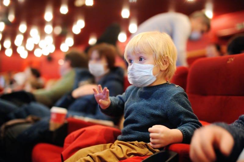 Moviegoers wearing face masks at the theater amid COVID-19 pandemic