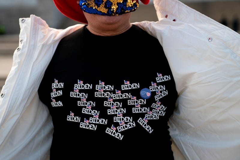 Kyriaki Chris, of Virginia, displays a Biden shirt while standing for a photo near the Lincoln Memorial on January 14, 2021 in Washington, DC. Due to security concerns, the National Mall will be closed on Inauguration Day, as people are encouraged to view inaugural events from their home. 