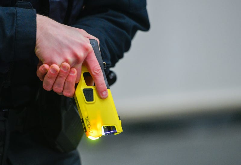 A police officer demonstrates the handling of an Taser on January 15, 2021 in Dortmund, Germany.