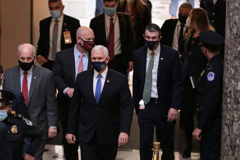  U.S. Vice President Mike Pence, (C), walks through Statuary Hall of the U.S. Capitol headed from the House Chamber at the U.S. Capitol January 6, 2021 in Washington, DC. Congress will hold a joint session today to ratify President-elect Joe Biden's 306-232 Electoral College win over President Donald Trump. A group of Republican senators said they would reject the Electoral College votes of several states unless Congress appointed a commission to audit the election results. (Photo by Cheriss May/Getty Images)