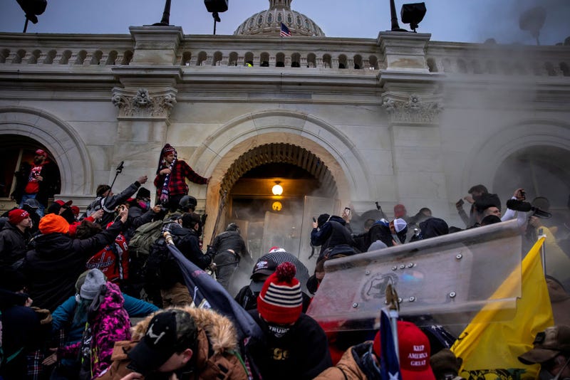Trump supporters clash with police and security forces as people try to storm the US Capitol on January 6, 2021.