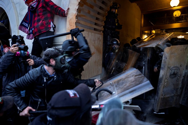 Trump supporters clash with police as they storm the US Capitol in Washington, DC., 1/6/21