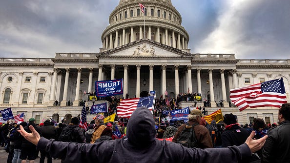 WATCH: Never-before-seen security footage of Capitol riot played at Trump's impeachment trial