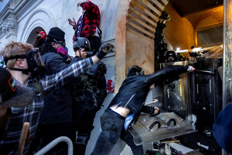 Trump supporters clash with police and security forces as people try to storm the US Capitol on January 6, 2021 in Washington, DC. 