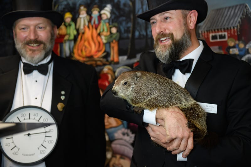 Punxsutawney Groundhog Club Inner Circle Members Jason Gursky and official handler, AJ Dereume and Punxsutawney Phil, the weather-predicting groundhog, work a Zoom call with schoolchildren in hundreds of schools throughout the United States on Gobblers Knob on February 1, 2021 in Punxsutawney, Pennsylvania