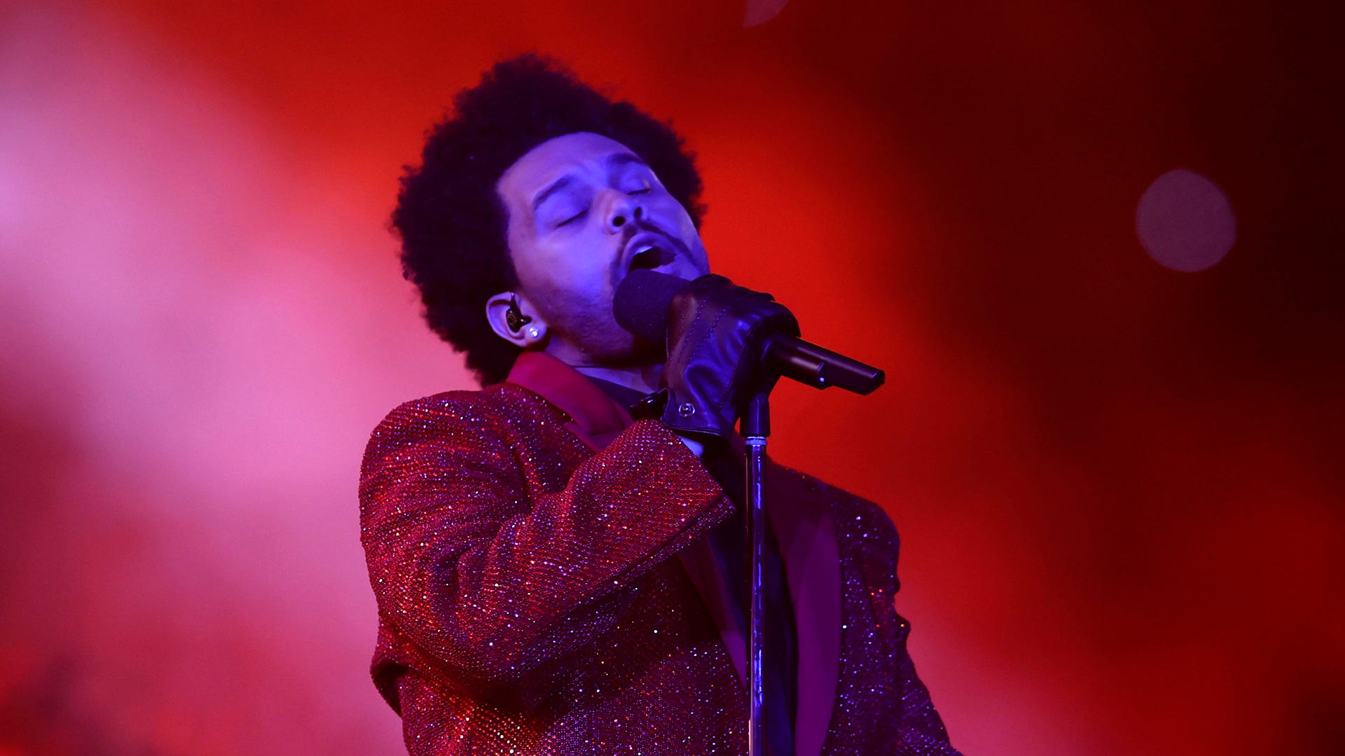 Watch as The Weeknd recruits a 'Squid Game' star and Jim Carrey for new 'Out Of Time' video