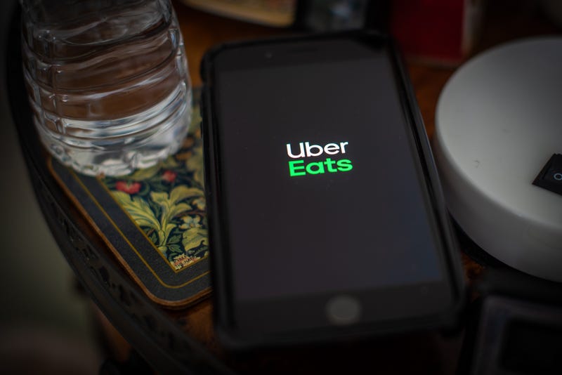 Uber Eats logo on cell phone