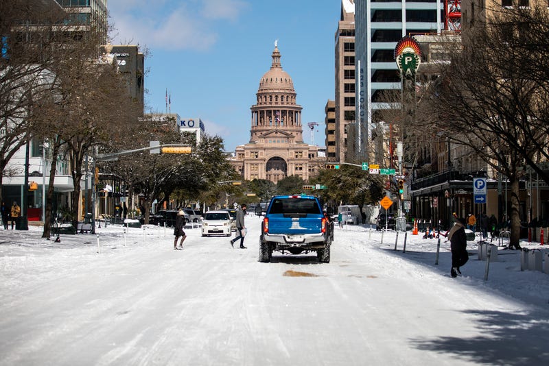 The Texas Capitol is surrounded by snow on Feb. 15, 2021, in Austin, Texas. Winter storm Uri has brought historic cold weather to Texas, causing traffic delays and power outages, and storms have swept across 26 states with a mix of freezing temperatures and precipitation.