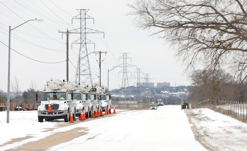 Pike Electric service trucks line up after a snowstorm on February 16, 2021, in Fort Worth, Texas.