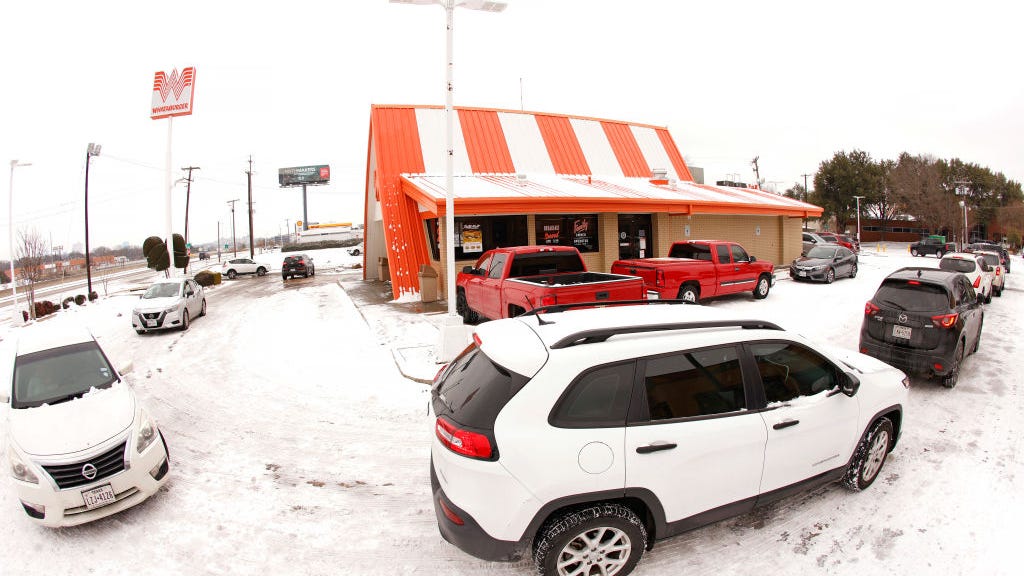 Gunmen rob an armored vehicle in a fast food drive through