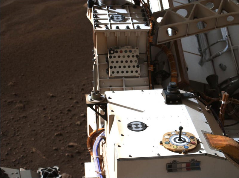 In this handout provided by NASA, Mastcam-Z, a pair of zoomable cameras aboard NASA’s Perseverance rover, images its calibration target for the first time since the rover landed on Mars. 