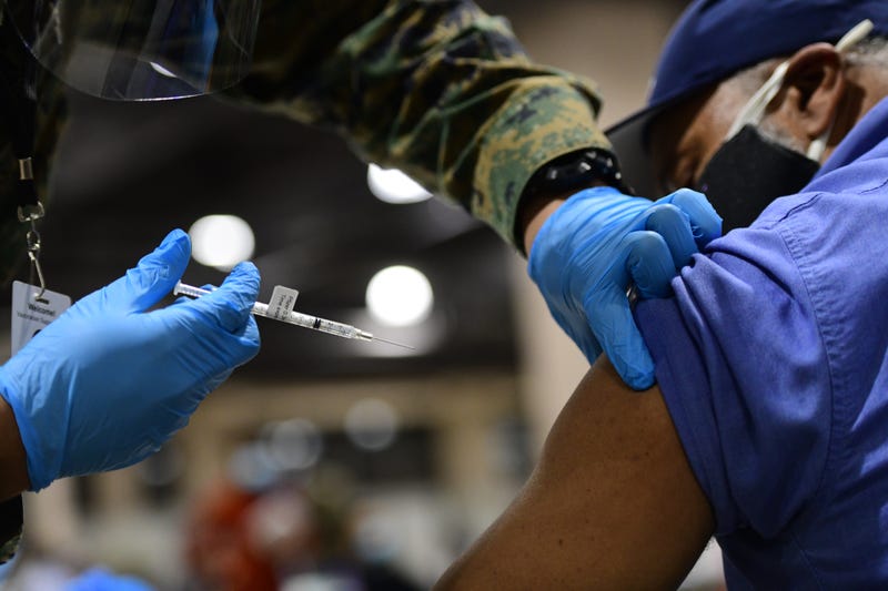 A dose of COVID-19 vaccine being administered at the Pennsylvania Convention Center in Philadelphia.
