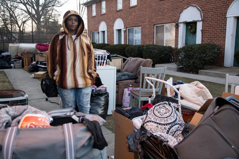 A friend watches over her evicted neighbor's belongings in Columbus, Ohio.