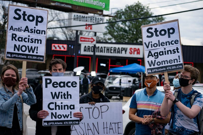 Activists demonstrate against violence towards women and Asian Americans