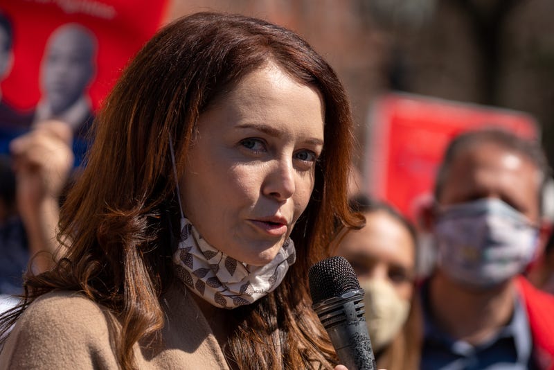 Former New York Governor Andrew Cuomo aide Lindsey Boylan and dozens of protesters gather at Washington Square Park to demand the governors resignation on March 20, 2021 in New York City. The demands for Governor Cuomos resignation are in response to the sexual harassment allegations made by numerous women and a cover-up preventable of coronavirus (COVID-19) deaths in nursing homes.
