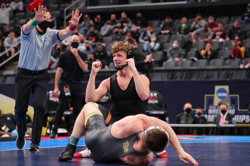 Shane Griffith of Stanford celebrates after beating Jake Wentzel in the 165lb weight class in the first-place match during the NCAA Division I Men's Wrestling Championship at the Enterprise Center on March 20, 2021 in St Louis, Missouri. 