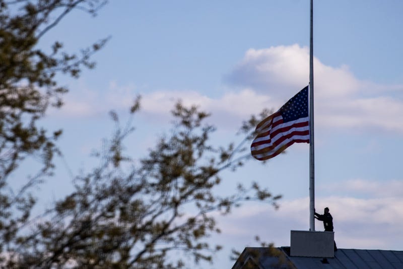 Capitol Police officers lower and replace the American flag to half staff over the U.S. Capitol to honor the Capitol Police officer that was killed in the line of duty earlier today on April 02, 2021 in Washington, DC.