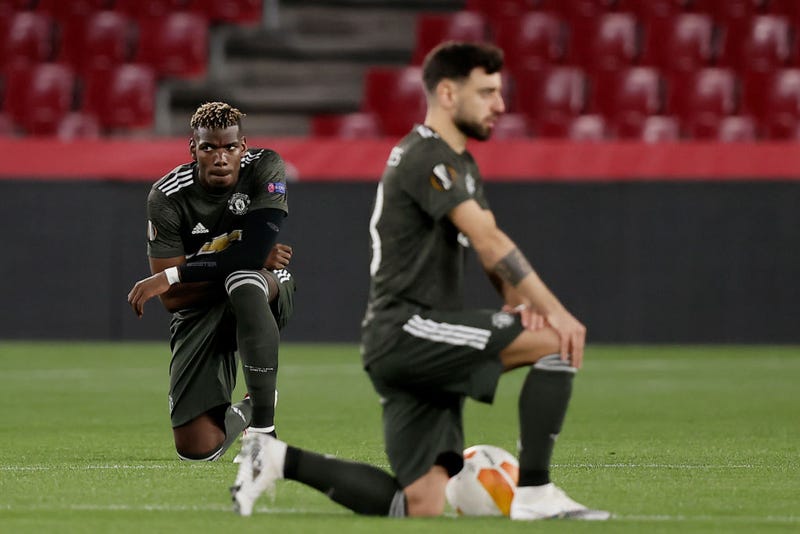 GRANADA, SPAIN - APRIL 8: Paul Pogba of Manchester United kneels down statement Black lives matter during the UEFA Europa League match between Granada v Manchester United at the Estadio Nuevo Los Carmenes on April 8, 2021 in Granada Spain (Photo by David S. Bustamante/Soccrates/Getty Images
