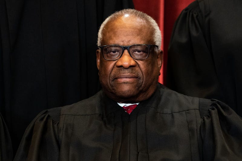  Associate Justice Clarence Thomas sits during a group photo of the Justices at the Supreme Court in Washington, DC on April 23, 2021. (Photo by Erin Schaff-Pool/Getty Images)