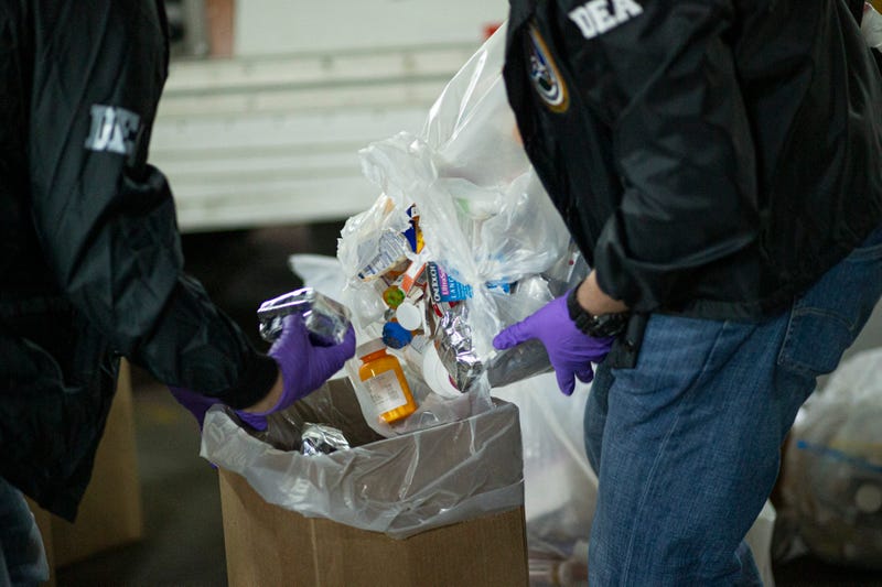 Prescriptions drugs collected during the Drug Enforcement Administration (DEA)s Take Back Day event are placed into plastic bags by members of the DEA in White Plains, New York on April 24, 2021. 