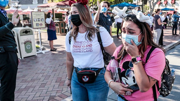 Disneyland visitors seen crying as park reopens for the 1st time in 412 days