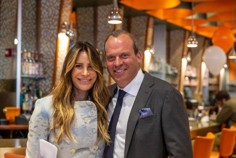 Gayle Perry and Alan Rosen attend U. S. Senator Charles Schumer marking re-opening of Junior's Cheesecake restaurant on Times Square on May 6, 2021.